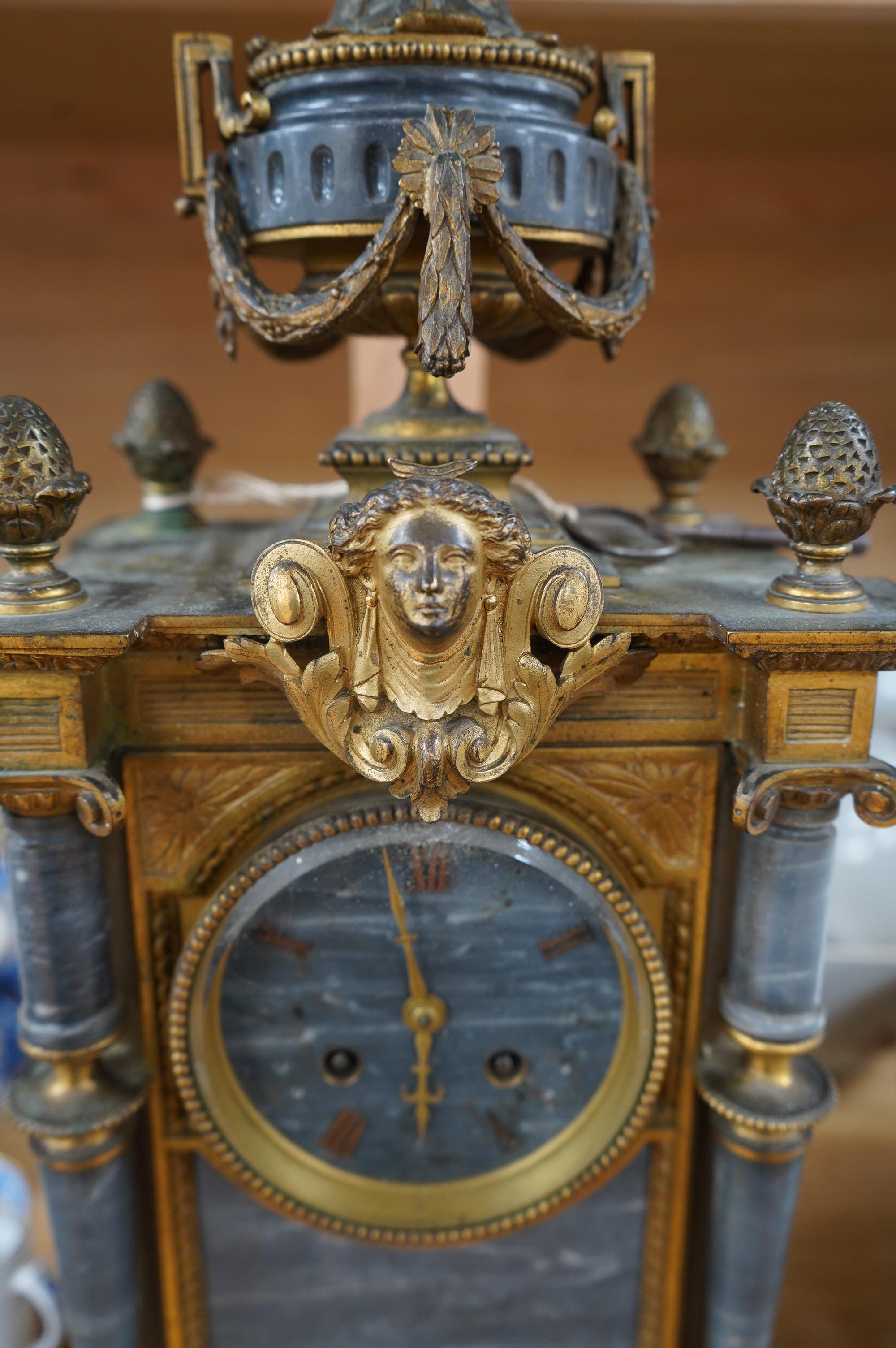 A 19th century French ormolu and marble mantel clock, striking on bell, with key, 44cm high. Condition - fair to good, untested